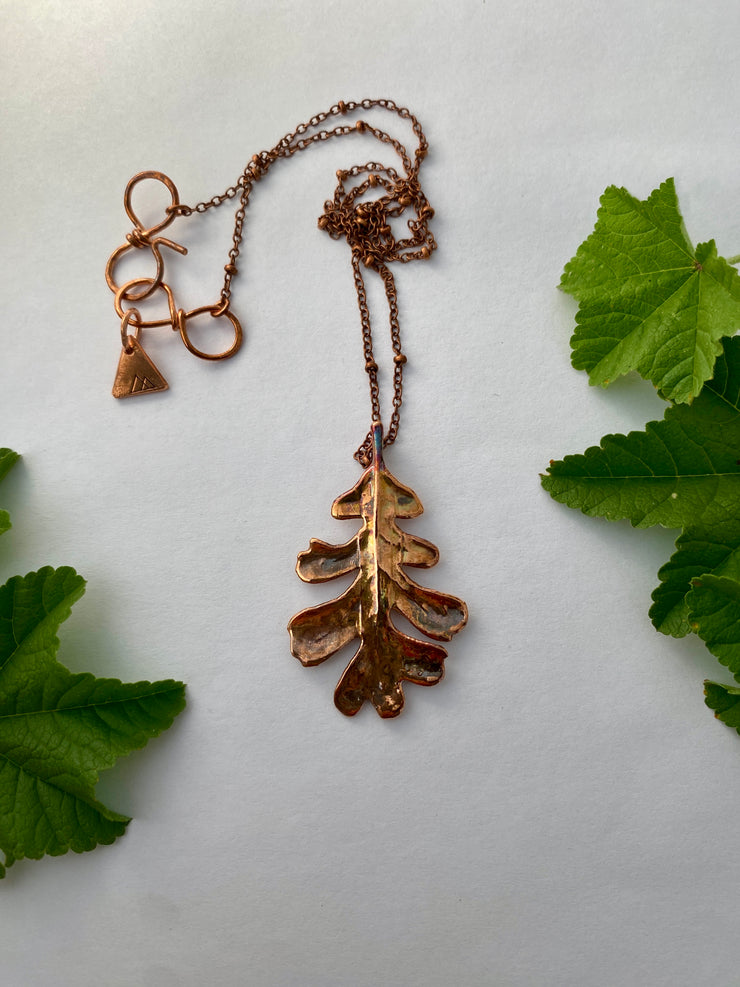 real oak leaf necklace encased in recycled copper infinity clasp simple wealth art made in usa electroplated oak leaf