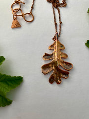 real oak leaf necklace encased in recycled copper infinity clasp simple wealth art made in usa electroplated oak leaf