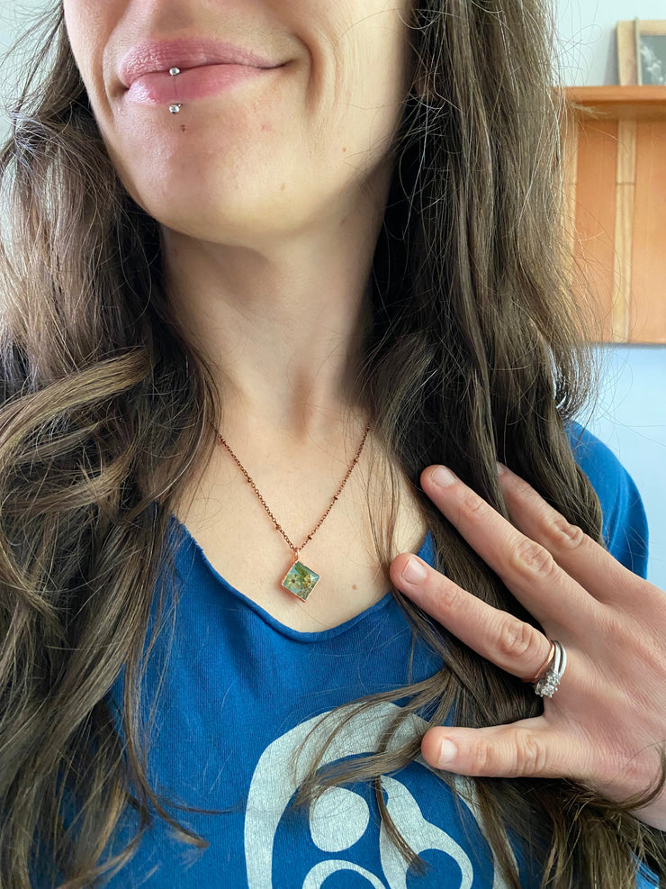 Tiny world necklace recycled copper dried flower resin necklace handmade in usa simple wealth art pictured on person