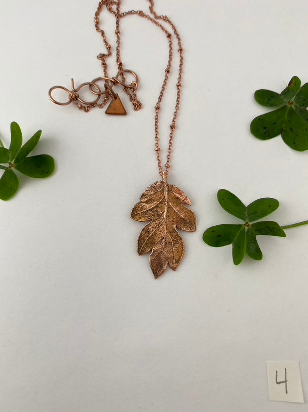 real oak leaf encased in recycled copper infinity clasp simple wealth art made in usa