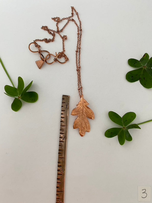 real oak leaf encased in recycled copper infinity clasp simple wealth art made in usa