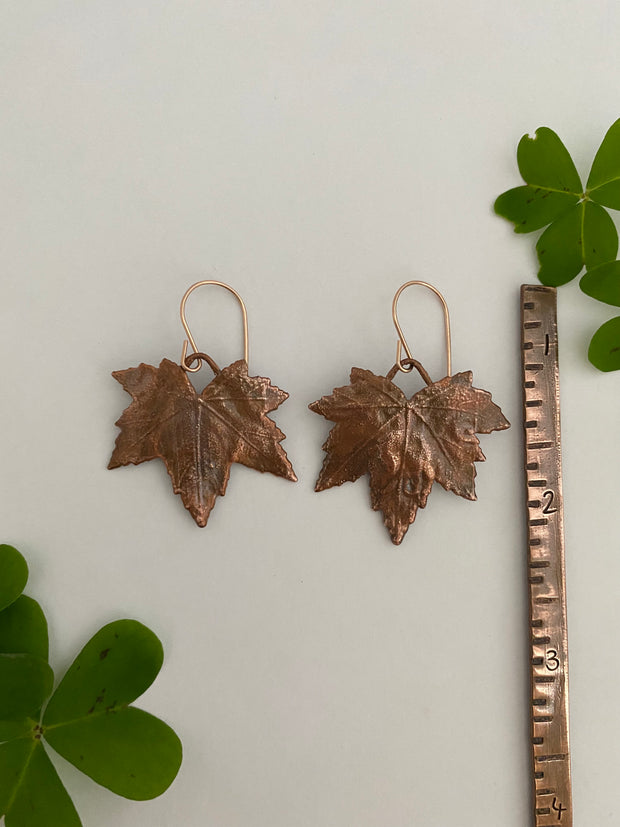 real mallow leaves encased in recycled copper 14 karat gold earwires by simple wealth art made in usa