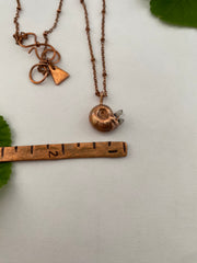snail shell electroplated in recycled copper with tiny quartz crystals made in usa simple wealth art