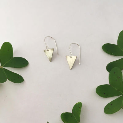 tiny triangle recycled brass drum cymbal triangle earrings simple wealth art made in usa recycled sterling silver