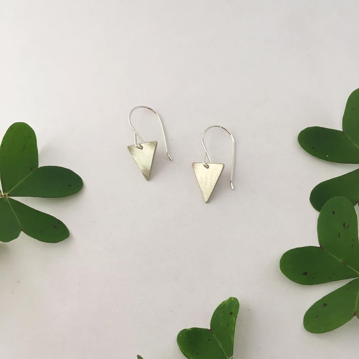 tiny triangle recycled brass drum cymbal triangle earrings simple wealth art made in usa recycled sterling silver