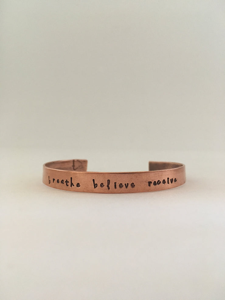 breathe believe receive hand stamped recycled copper mantra cuff