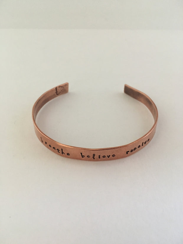 breathe believe receive mantra hand stamped recycled copper cuff